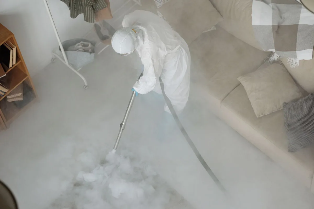 Biohazard cleanup technician in protective equipment, Huntland, TN